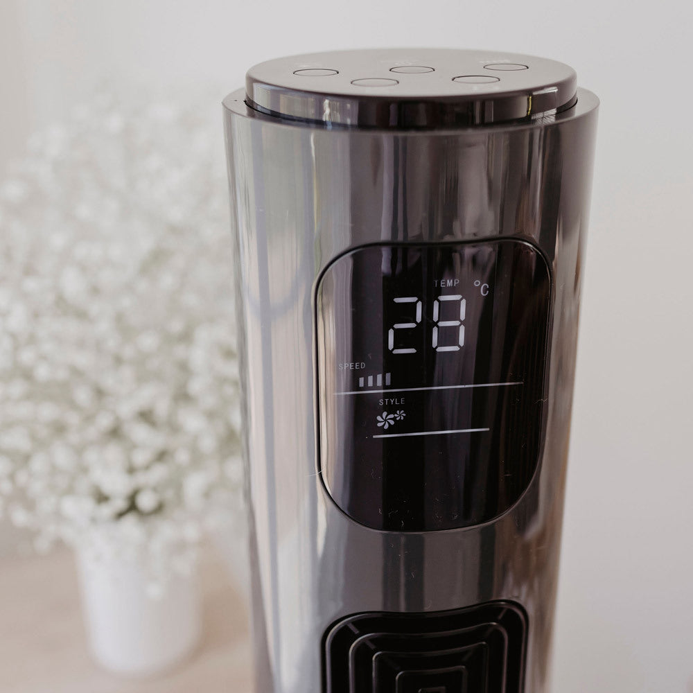 Charcoal Tower Fan with digital display on a blurred background