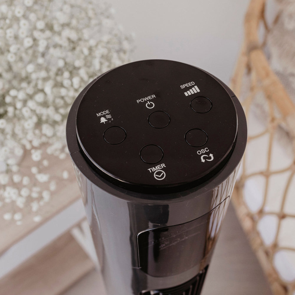 Charcoal Tower Fan with digital display on a blurred background