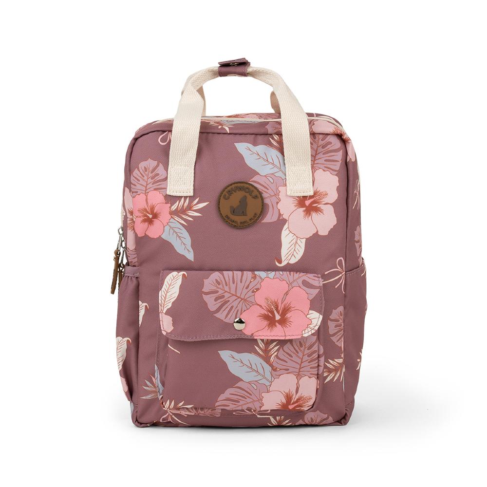 A dusty rose pink floral backpack with cream-colored top handles, featuring a front pocket with a snap button and a circular brown logo patch on the front.
