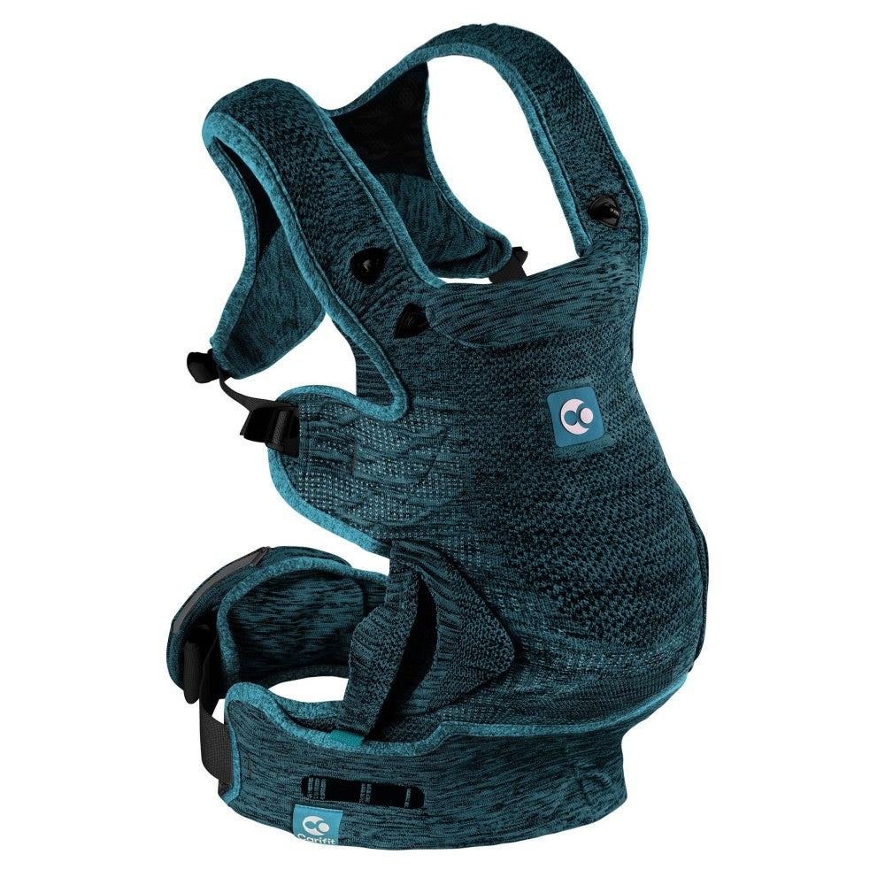 A baby carrier with a textured heathered teal blue fabric, featuring black plastic buckles and a small blue brand patch on the front.