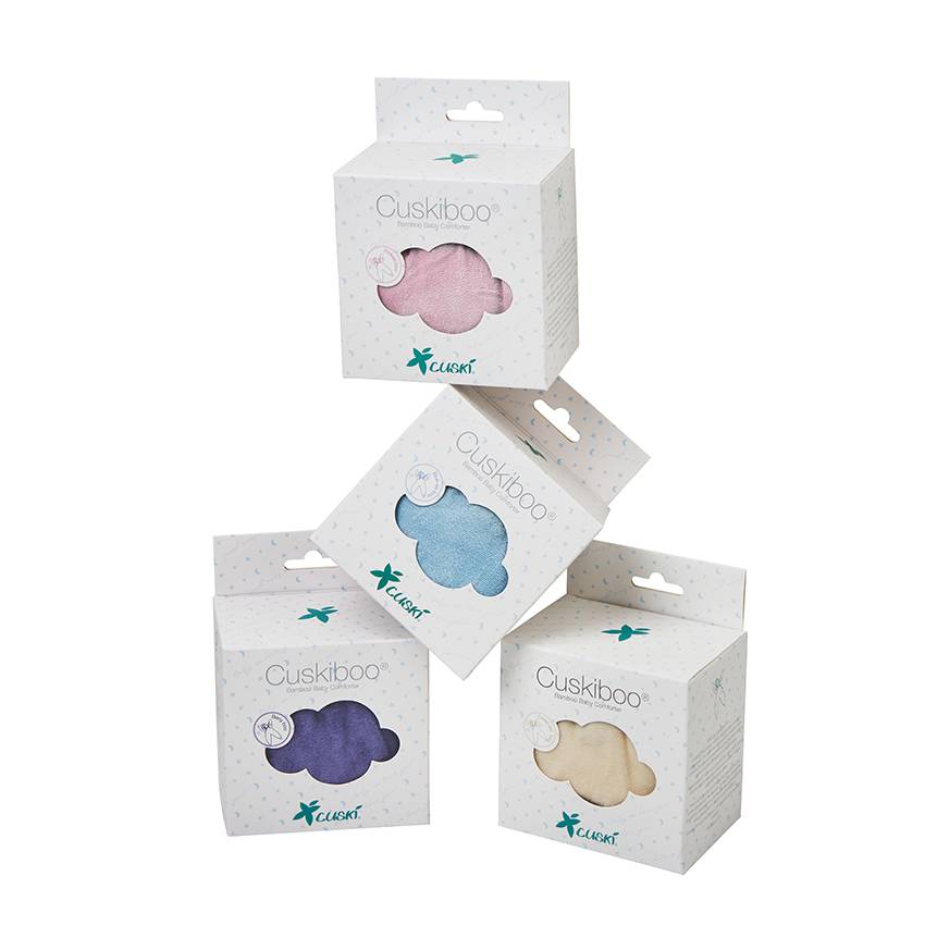 Four Cuskiboo infant comforters in white packaging, showing the pink, blue, purple, and beige cloud-shaped toys through the window cutouts.