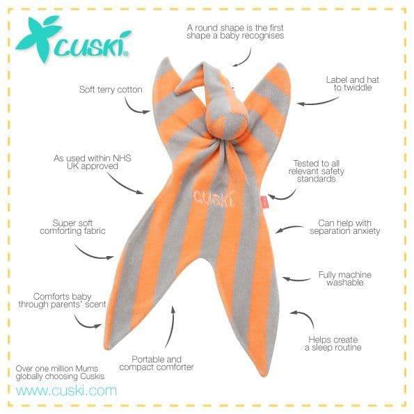 An orange and gray striped Cuski baby comforter with text callouts explaining its features, shown on a white background with a yellow border.