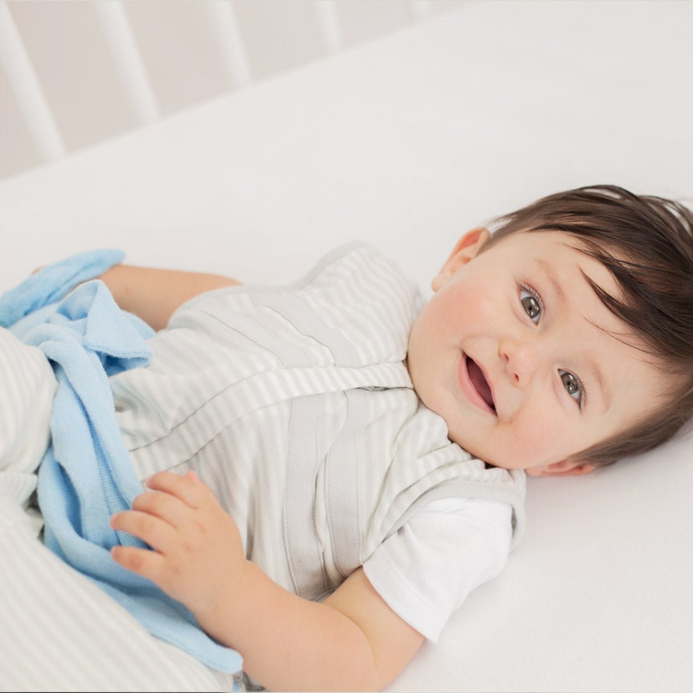 Infant in cot with Blue Cuskiboo