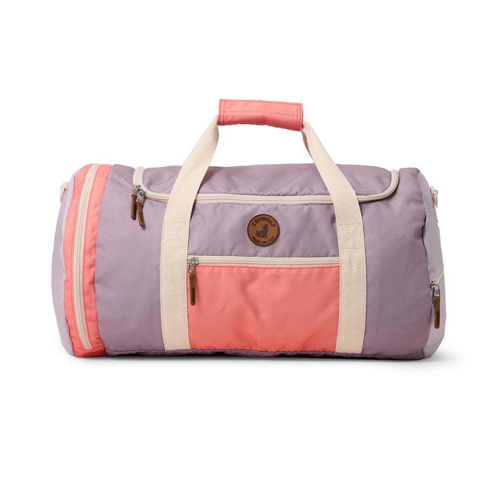 Multicolored duffel bag with pink, purple, and beige sections on a white background