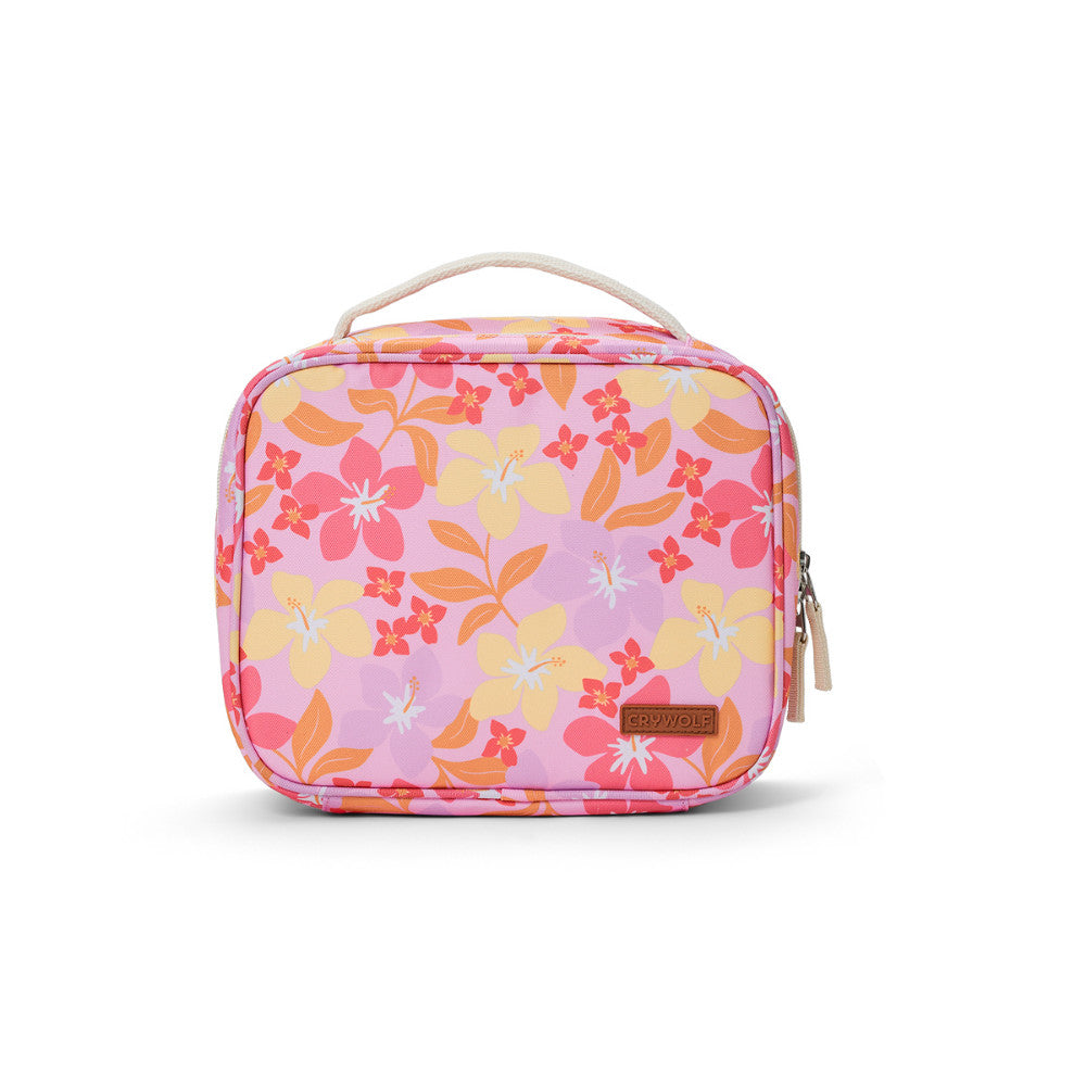 A square pink lunch bag with a floral print in shades of pink, orange, and yellow, featuring a top handle and a small brown brand patch that reads 'CRYWOLF'.