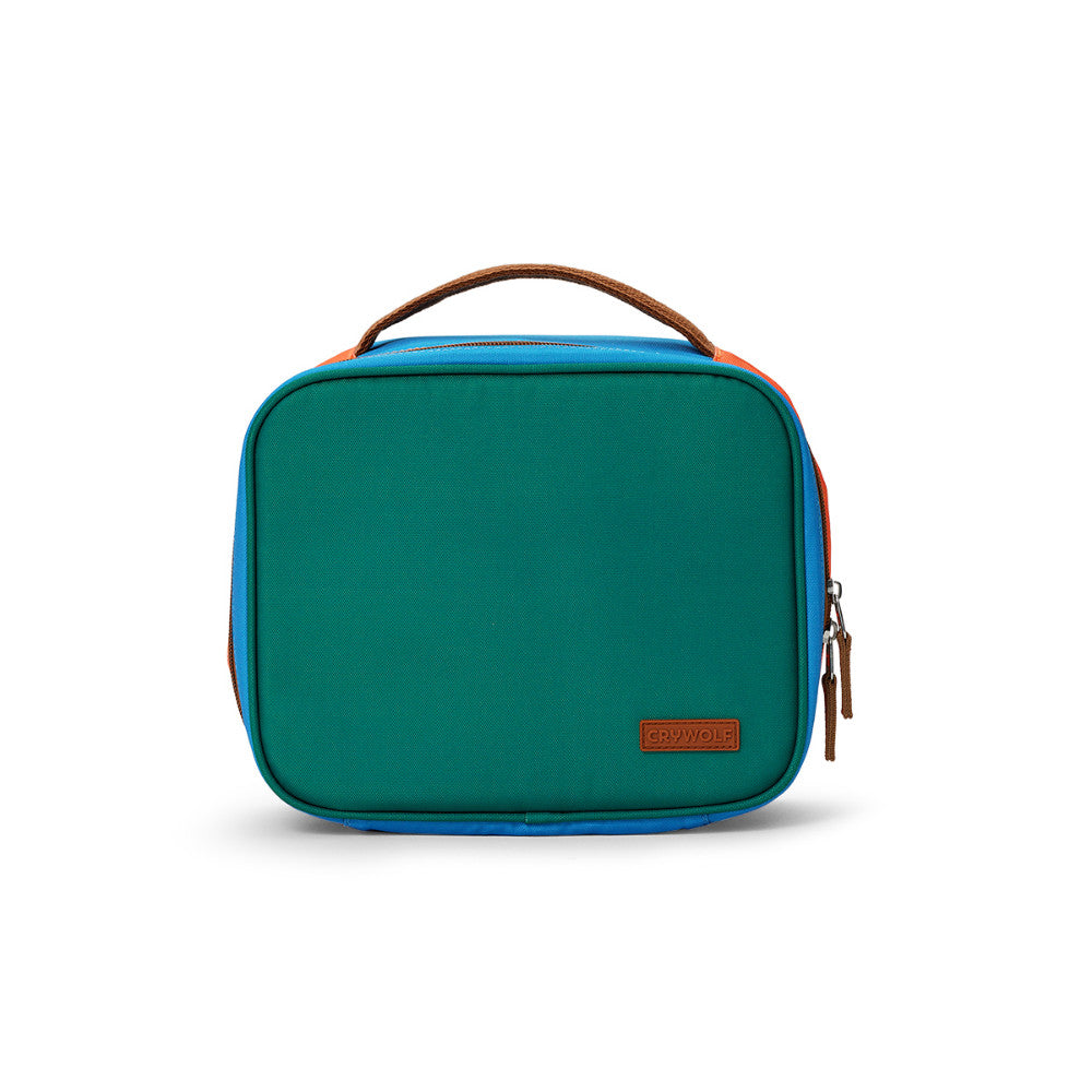 A rectangular lunch bag  in teal green with bright blue side panels, a brown top handle, and a small brown brand patch on the front, shown on a clean white background.