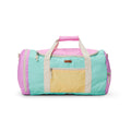 A pastel color-blocked duffel bag with a mint green body, pink top and side panels, a pale yellow front pocket, and cream handles, shown on a white background.
