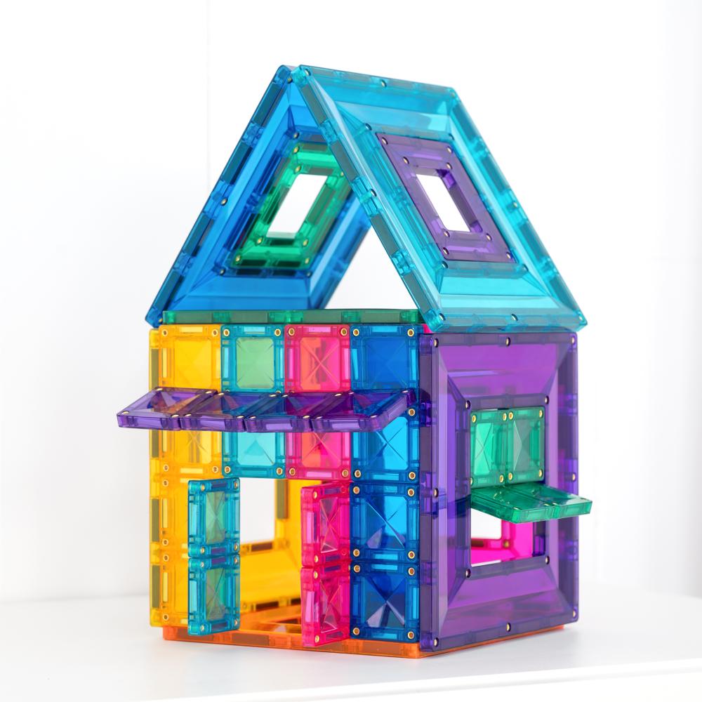 Colorful magnetic building block set shaped like a house on a white background
