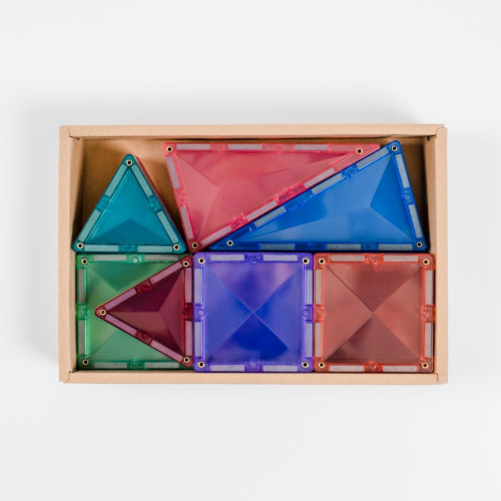 Colorful transparent geometric shapes in a wooden box on a white background