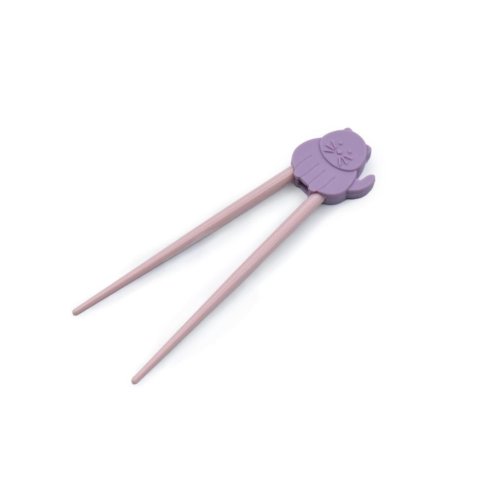 Pair of pink kids learning chopsticks with a purple clip on a white background