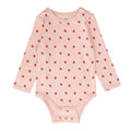 Pink organic cotton baby bodysuit with red strawberry pattern on a white background