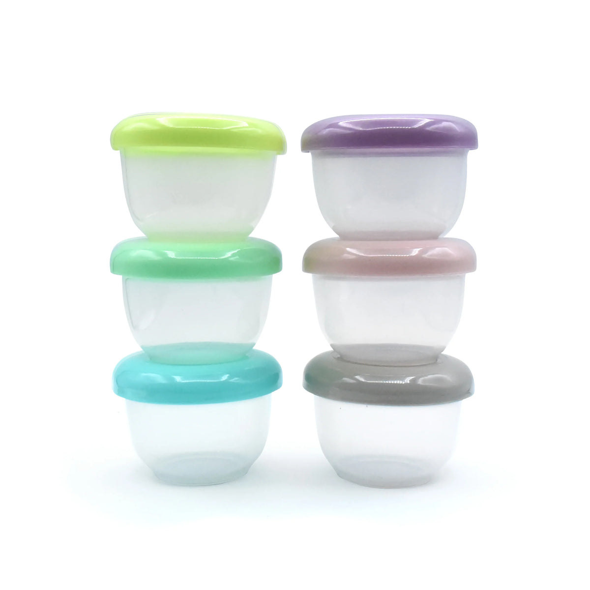Six small round plastic storage containers stacked in two columns of three, each with a different colored lid: lime green, mint green, turquoise, lavender, blush pink, and dark gray. The containers are made of transparent plastic and are photographed on a clean white background.
