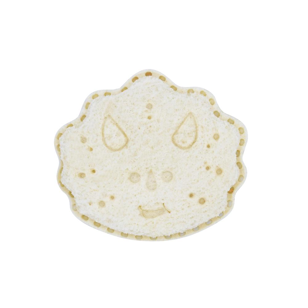 Dino-shaped bread on a white background