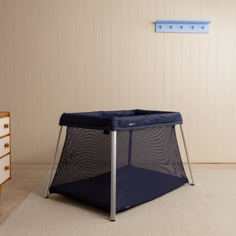 Drift cot in a nursery setting. 