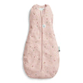 Pink baby swaddle bag with floral pattern on a white background