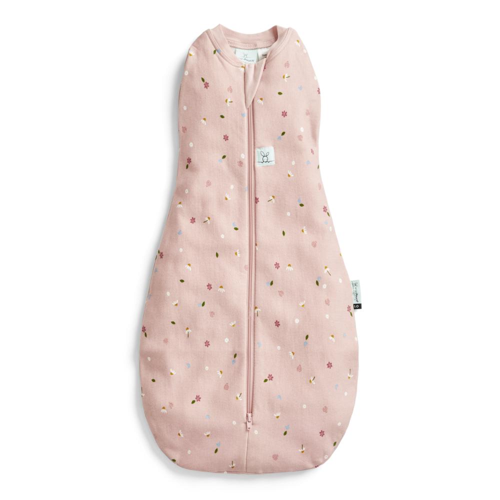 Pink baby swaddle bag with floral pattern on a white background