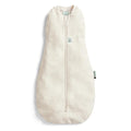 Beige baby sleeping bag with a zipper on a light gray background