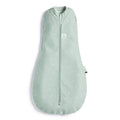 Light green prem sized baby swaddle bag with star pattern on a white background
