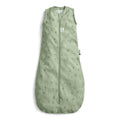 Green baby sleeping bag with plant pattern on a white background