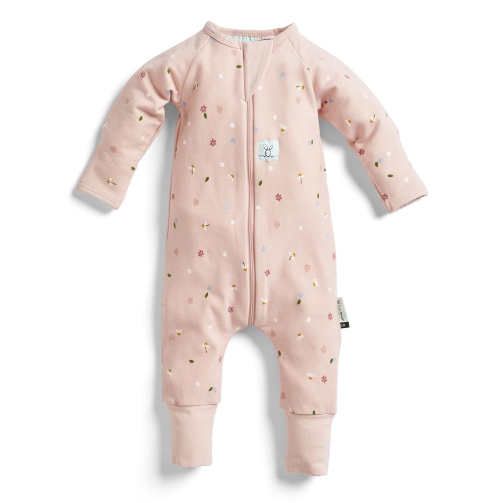 Pink baby onesie with floral patterns on a white background