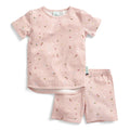 Pink children's summer pajama set with floral pattern on a white background