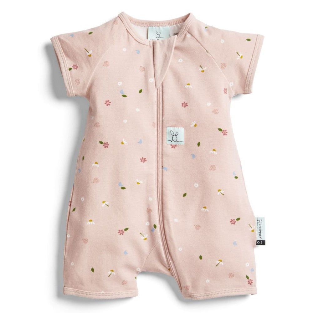 Pink baby romper with floral pattern on a white background