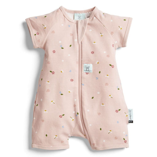Pink baby romper with floral pattern on a white background
