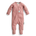 Pink baby onesie with a small tag on a white background
