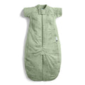 Green baby sleeping bag with shoulder straps on a white background
