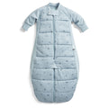Blue baby sleeping bag with dragonflies on a white background