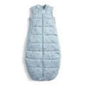 Light blue quilted baby sleeping bag with subtle pattern on a white background