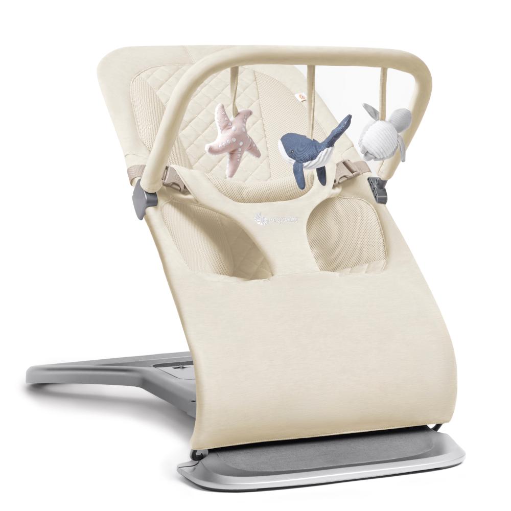 Beige baby bouncer with colorful toys on a white background