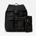 Fashion black nappy backpack with a change mat included on a light gray background