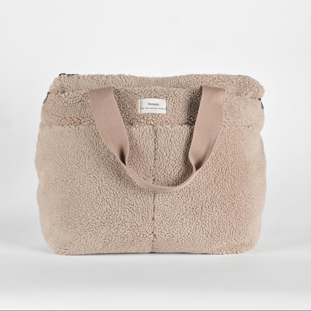 Beige sherpa nappy tote bag with brown handles on a white background