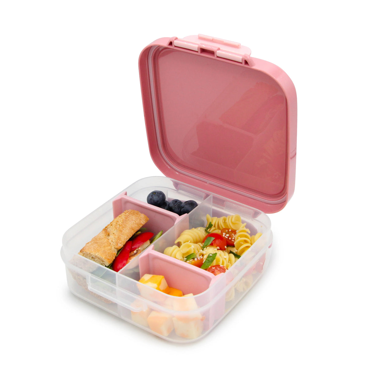 Pink bento box with compartments containing a sandwich, salad, and fruit on a white background