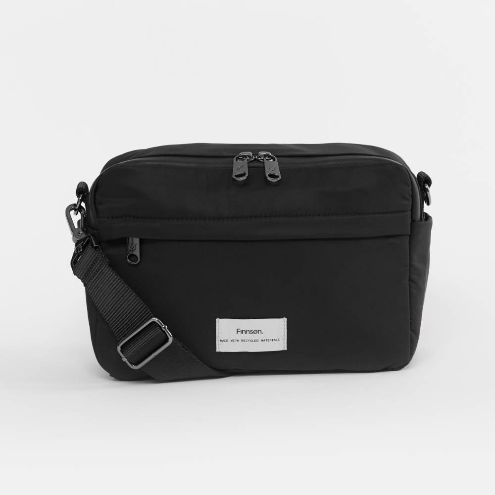 Black Nappy Bag with Finnson label on a white background