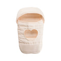 A cream-colored quilted baby toy sleeping bag with a heart-shaped cutout on the front, shown against a plain white background.