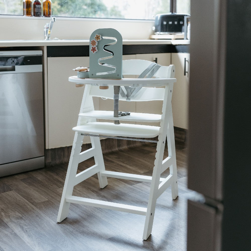 White Hauck wooden high chair on a white background