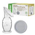 Haakaa silicone breast pump with cap and packaging on a white background