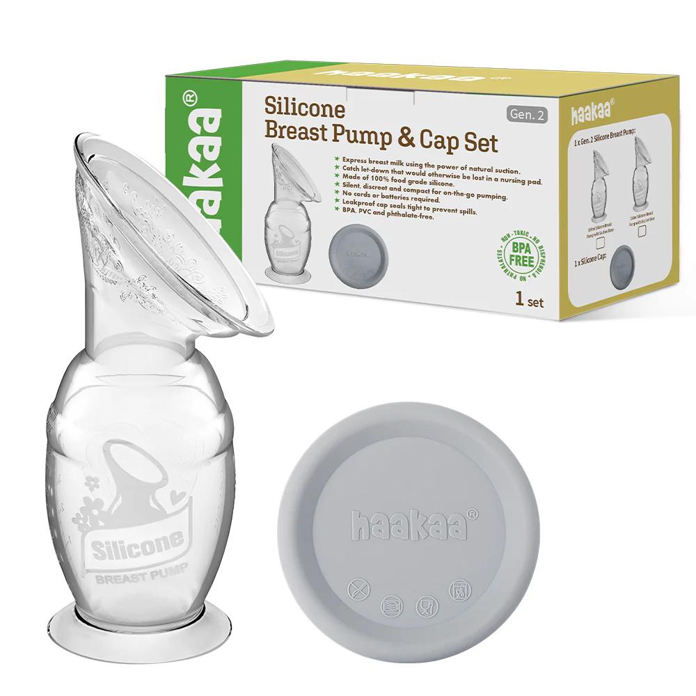 Haakaa silicone breast pump with cap and packaging on a white background