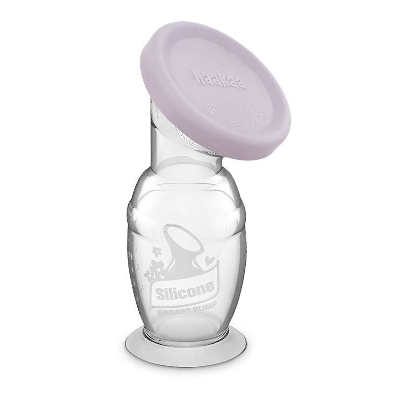 A clear silicone breast pump bottle with a light purple silicone flange lid, shown on a plain white background.
