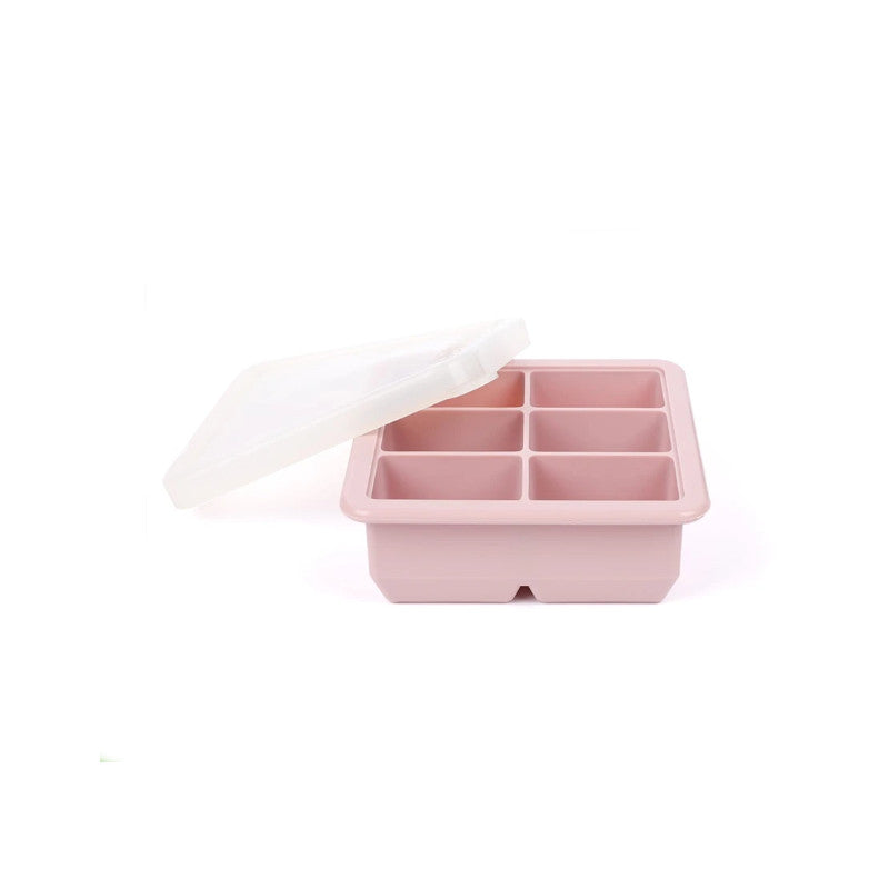 A six-compartment silicone ice cube tray in a dusty pink color, shown with its translucent white lid propped open on a clean white background.