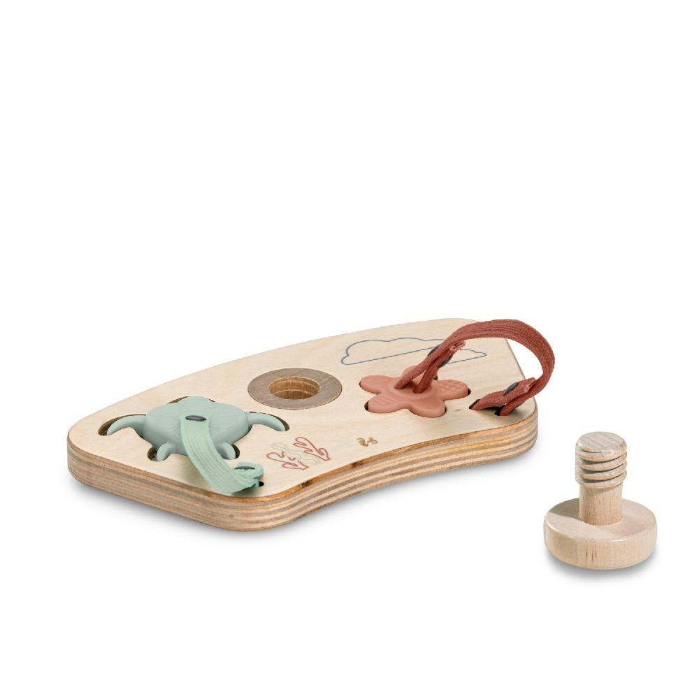 Wooden toy with turtle figure and floral design puzzle on a white background