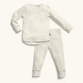 Children's beige pajama set on a white background