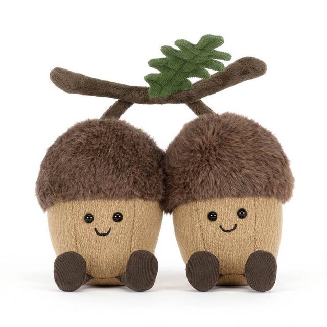 Brown Jellycat acorn soft toys with green leaf against white background. 
