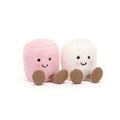 Two cute plush marshmallows side by side on a white background. The left marshmallow is light pink with a black embroidered smiley face and brown feet.