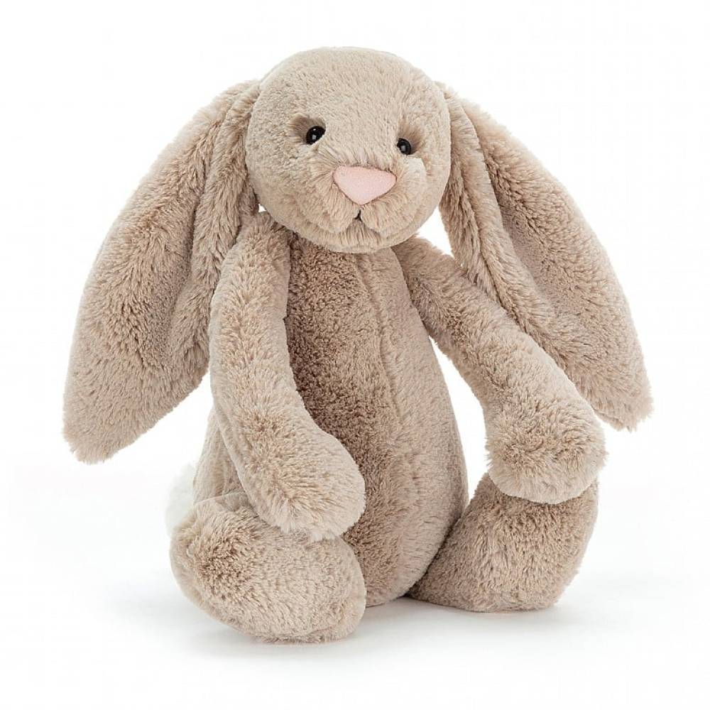 Beige Jellycat bunny soft toy sitting against white background.