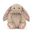 Beige Jellycat bunny soft toy with floral print on ears against white background.