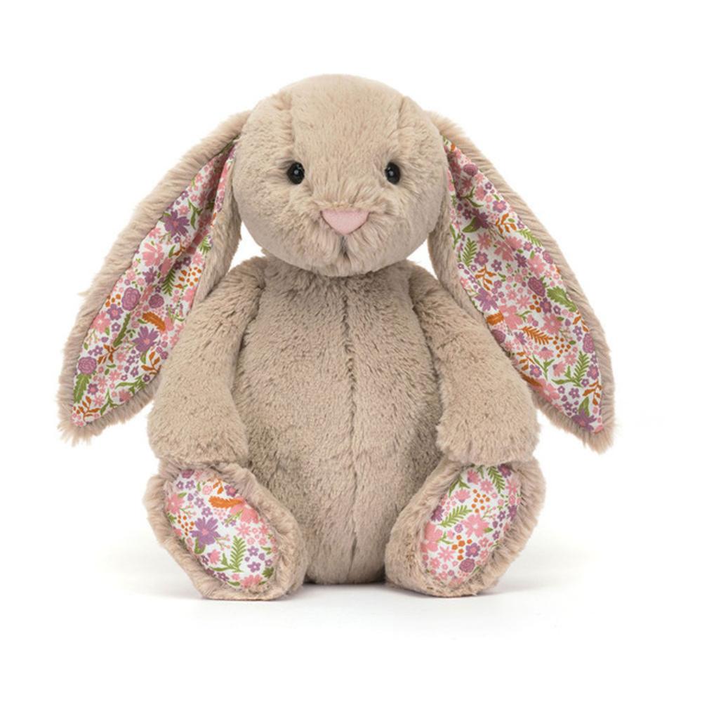 Beige Jellycat bunny soft toy with floral print on ears against white background.