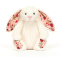 White Jellycat Bunny with pink and red floral ears against white background.